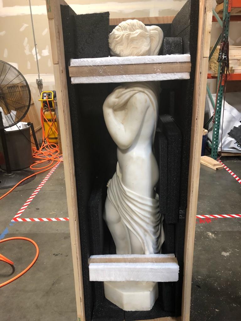 crated marble statue